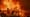 The Eaton Fire burns a structure on Jan. 8, 2025, in Altadena, Calif. (AP Photo/Ethan Swope)
