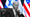President Biden sitting in front of row of Israeli and American flags.