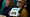 Sally Greenberg, with the National Consumers League, right, holds a sign that says "Defend CFPB".