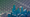 In a composite image, the Chicago skyline is overlaid on a field of solar panels.