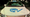 An electric car with a sticker on the hood that says "EV Society."