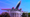 A photo of the White House is overlaid on an image of a Boeing jet, rising up from behind the White House.