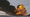 A fireball goes up at the site of an oil train derailment.