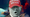 In a composite image, President Trump wearing a MAGA hat overlaid on a photo of the Deepwater Horizon disaster.